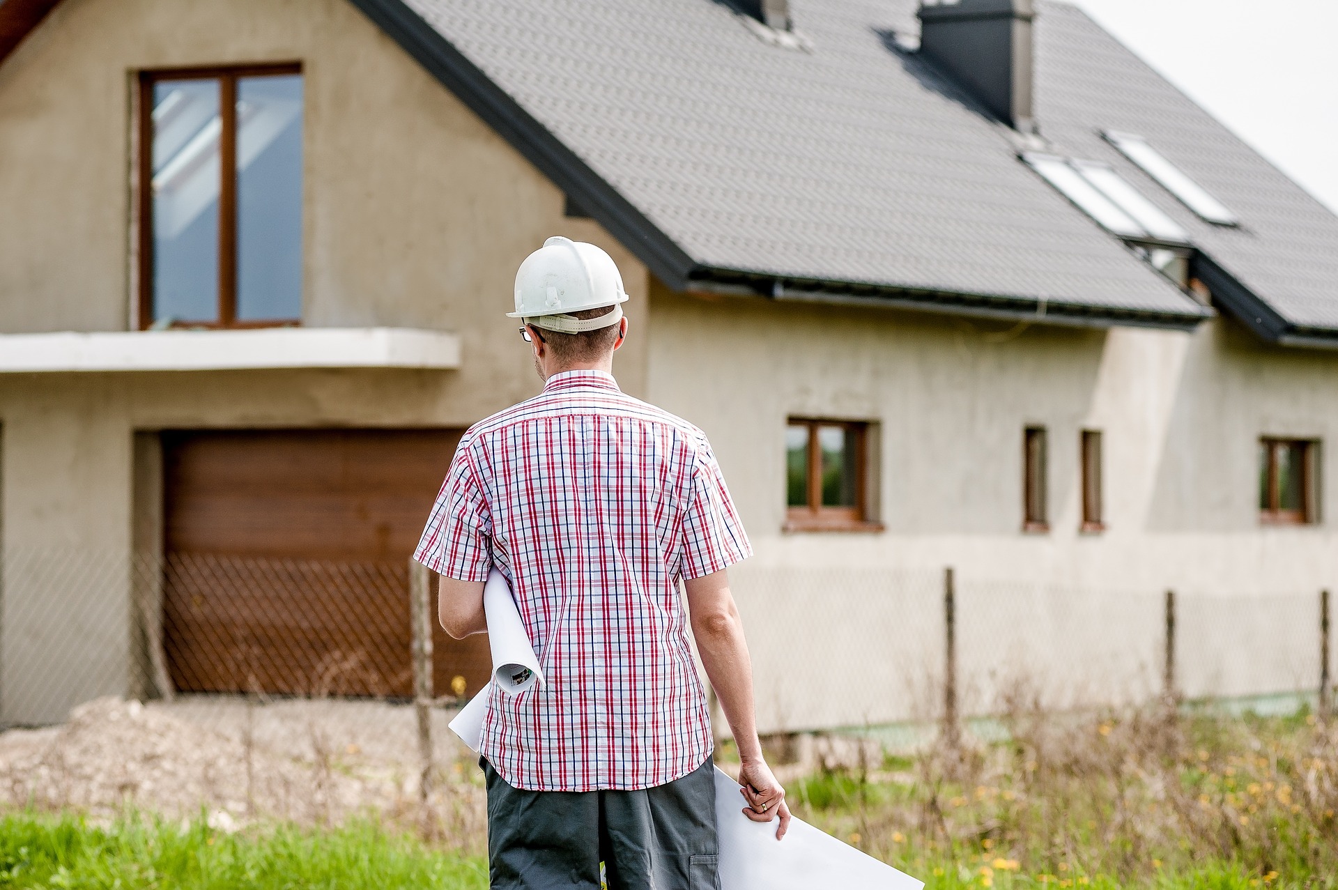 architect looking at a house