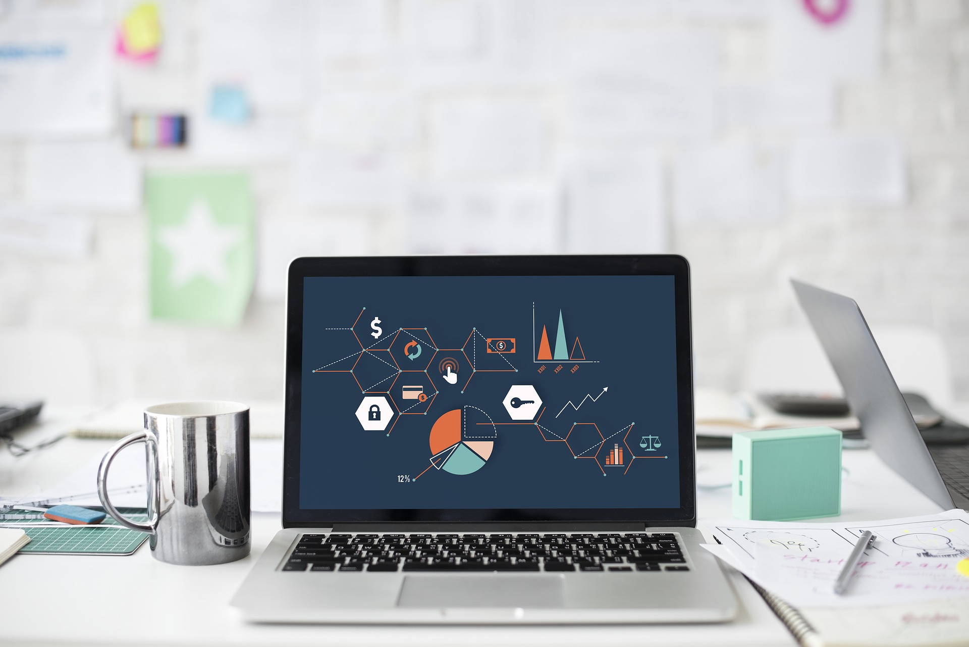 laptop screen showing graphs and figures