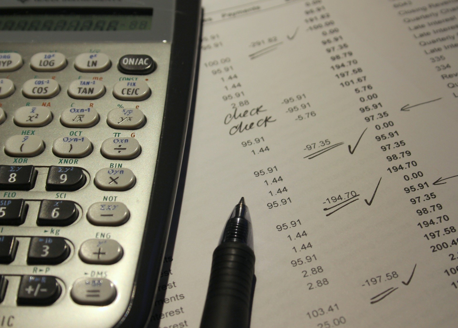 close up image of tax paperwork and a calculator