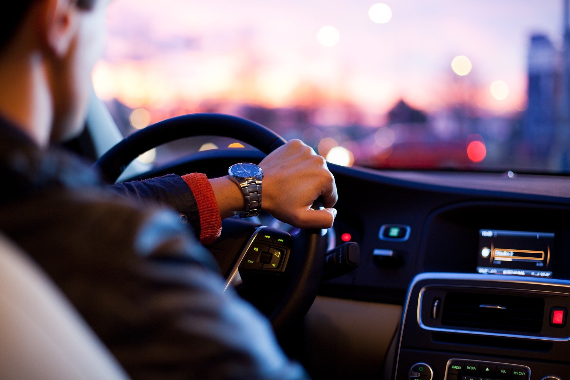 close up foused shot of a young driver holding a steering wheel