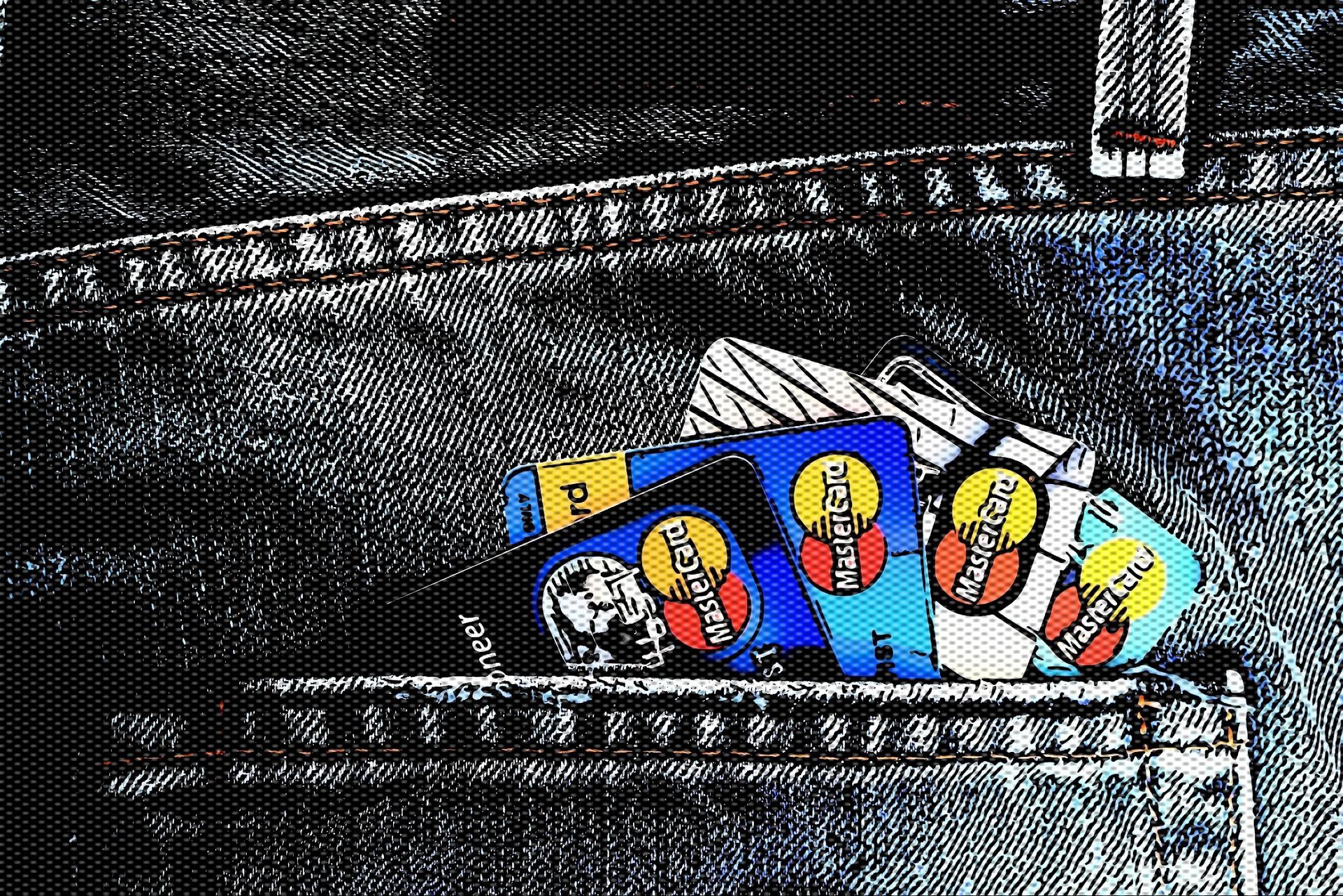 credit cards popping out of a jean pocket