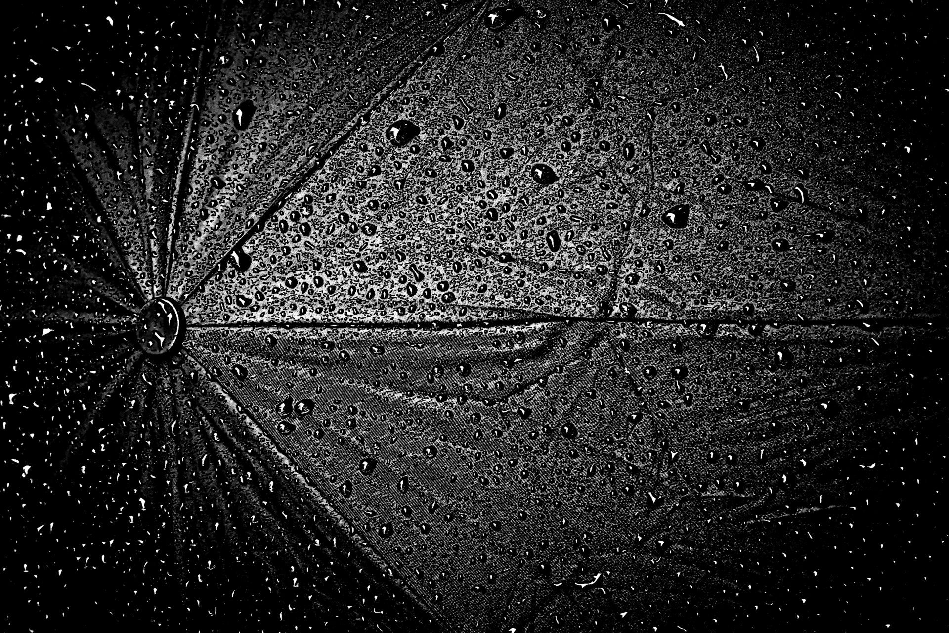 close up image of rain on an umbrella