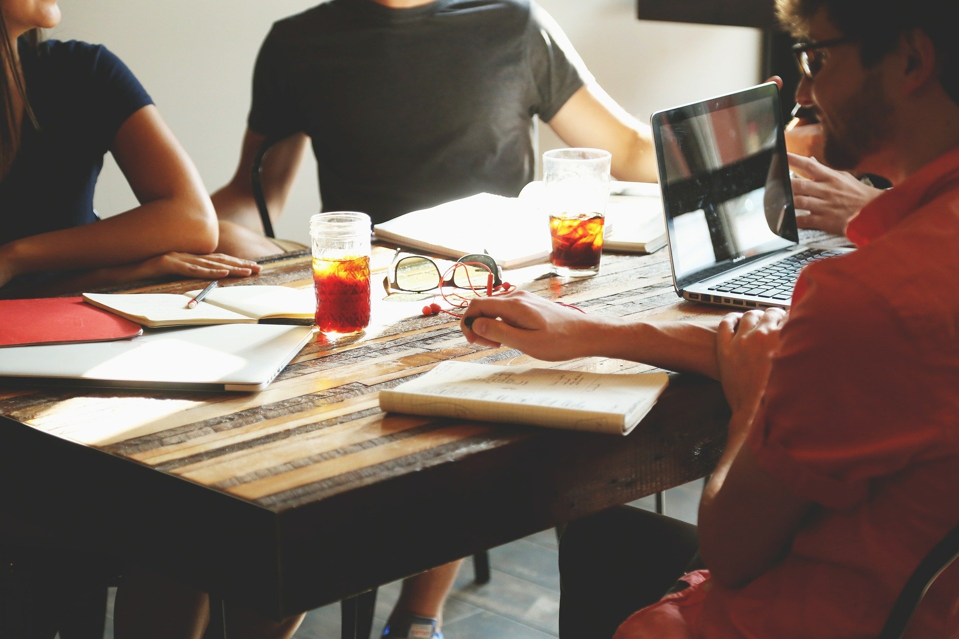 small team holding a company meeting