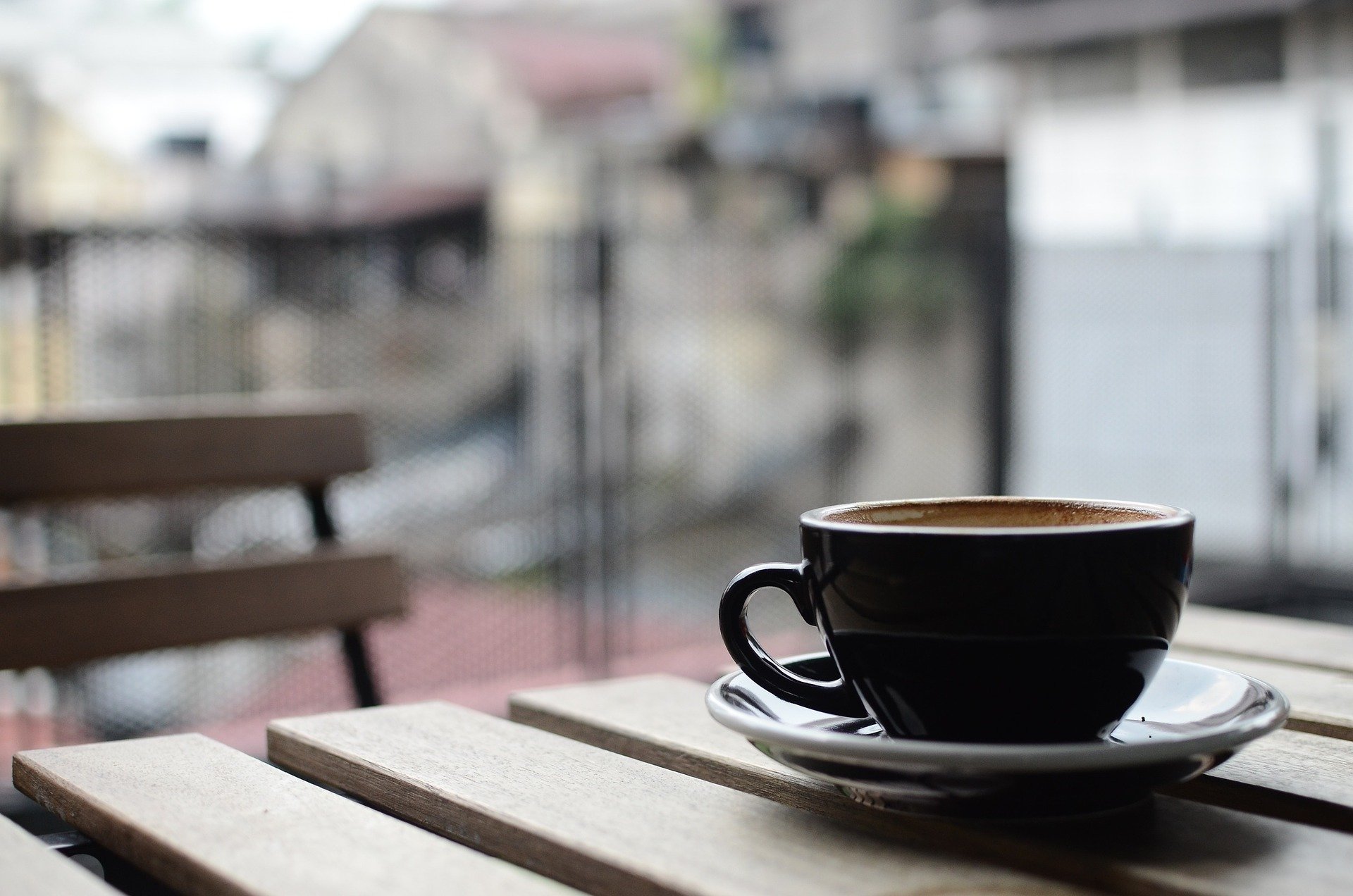 close up shot of a coffee mug at an outdoor table