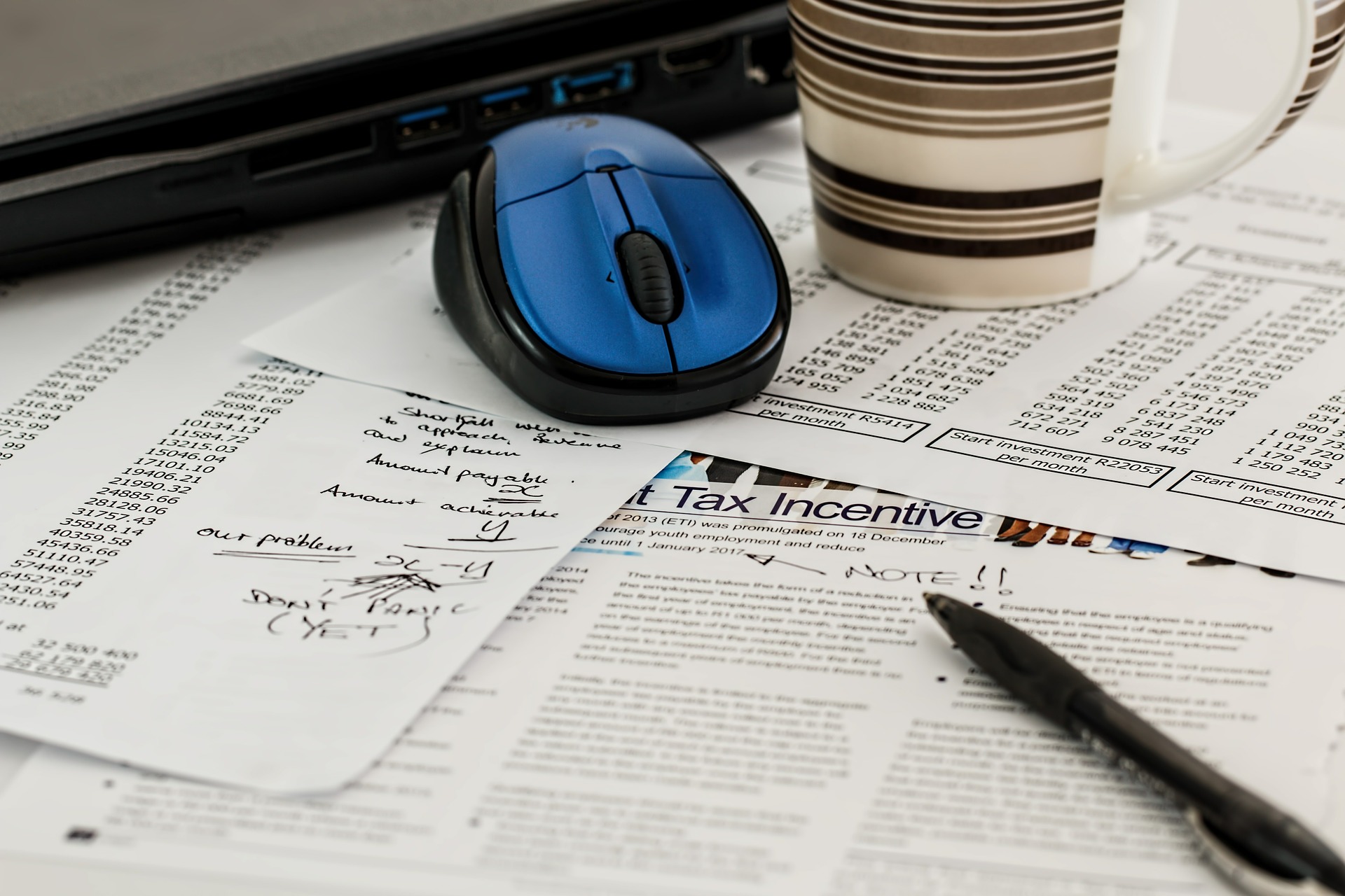 tax paperwork sprawled across a desk